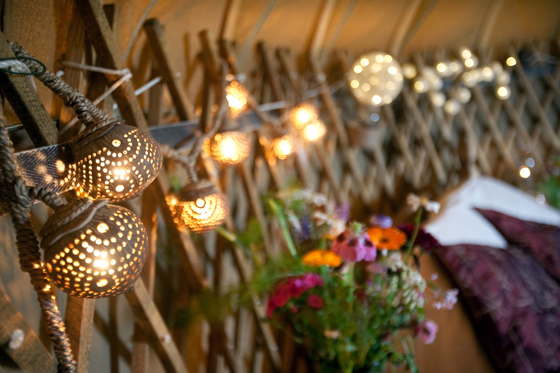 Soft lighting and wildflowers inside of Mulroy yurt