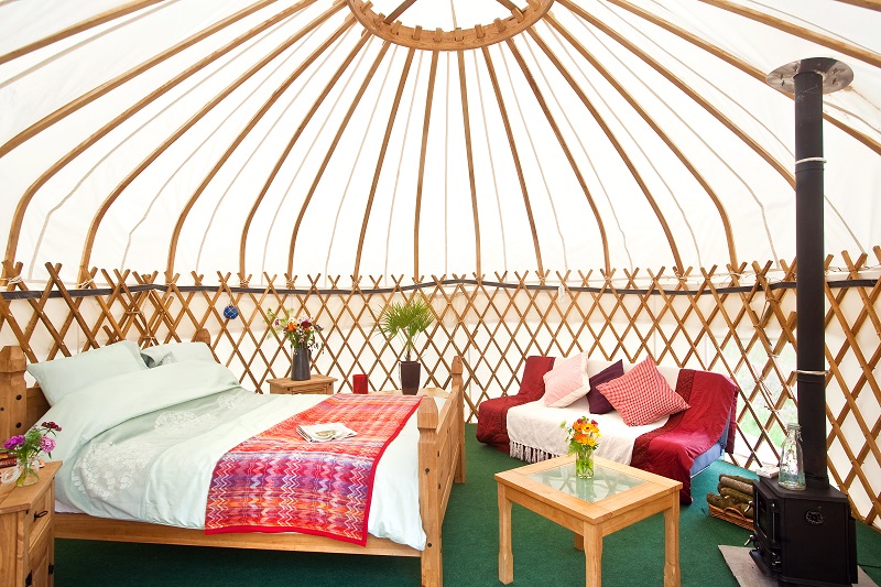 The interior of Ballymastocker with king size bed, double sofa bed and wood burning stove